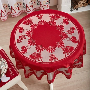 Red Christmas lace tablecloth featuring reindeer and bell patterns for festive home decor