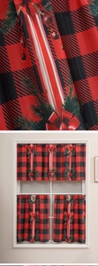 Detail of Christmas buffalo plaid curtains with pine branch and red bow prints