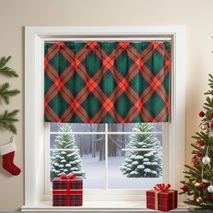 Christmas plaid cafe curtains in red and green tartan hanging on a snowy window scene