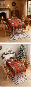 Detailed Christmas table decor set featuring red and green plaid patterns and floral cushions
