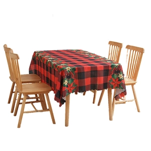 Red and green buffalo plaid rectangular tablecloth with festive Christmas floral border