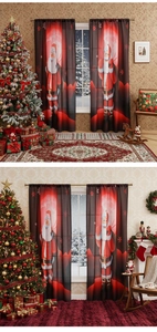 Detail of red and black gradient Christmas curtains featuring Santa Claus and snowflake motifs