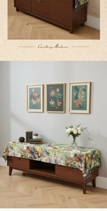 Detail of oil painting style dust cover with floral patterns and beaded fringe tassels