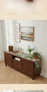 Close-up of impressionist floral table runner with elegant fringe on a wooden cabinet