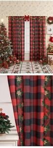 Close-up of red and black buffalo plaid Christmas curtains with festive floral prints
