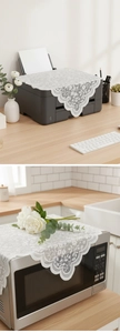Detailed close-up of white floral lace dust cover for microwave and printer top decoration