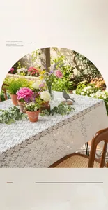 Detailed view of French style white lace tablecloth with floral hollow embroidery