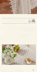 Detail of floral lace embroidery on cream tablecloth with elegant scalloped edges