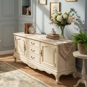 Classic cream-colored sideboard cabinet with floral table runner in an elegant home setting