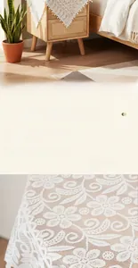 Detailed macro view of white lace tablecloth with hollow floral pattern on a wood cabinet