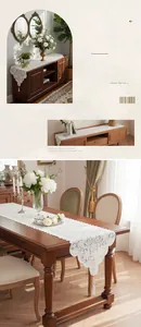 Detailed white lace table runner with floral crochet patterns and elegant tassels