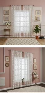Detail of white lace curtain with vintage floral patterns and scalloped edges