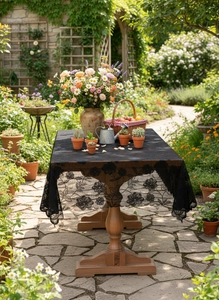 Close-up of black lace tablecloth with floral embroidery on outdoor wooden table