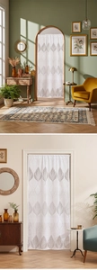 Detail of French vintage lace door curtain with grey leaf pattern on white semi-sheer fabric