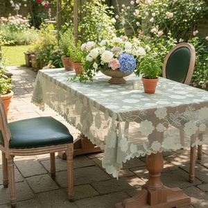 Sage green rectangular lace tablecloth with delicate floral embroidery and scalloped edges