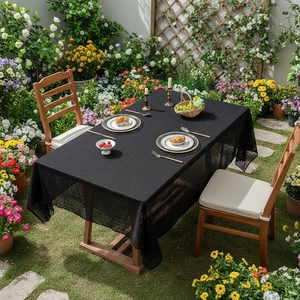 Modern black geometric lace tablecloth for outdoor dining table with floral garden decor
