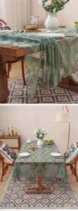 Macro detail of Morandi green lace tablecloth with scroll patterns and scalloped edges