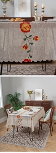 Macro detail of beige lace tablecloth featuring floral embroidery and wavy edges