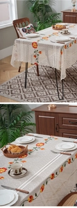 Detailed view of cream lace tablecloth featuring vintage floral embroidery and wavy edges
