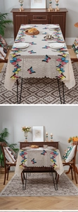 Close-up of beige lace cover with colorful butterfly embroidery for home appliances