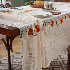 Lace tablecloth with tulip embroidery and wavy edges for elegant dining table decor