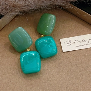 Retro geometric resin block earrings in olive green and marbled teal with gold accents