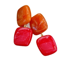 Geometric resin drop earrings with orange marble and red square block design