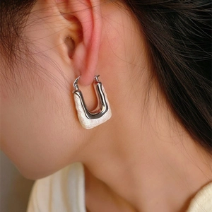 French vintage 18K gold plated cotton pearl hoop earrings on model with white matte texture