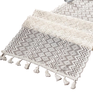 Handmade bohemian ivory crochet table runner with geometric knit patterns and fringe