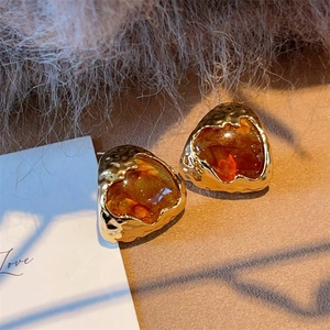 Vintage amber resin geometric stud earrings with gold textured metal in warm setting
