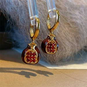 Elegant gold pomegranate hoop earrings with red micro-inlaid stones and enamel finish