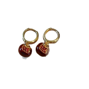 Elegant gold hoop earrings with pomegranate red stone pendants in a creative fruit design