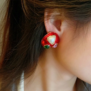 Vintage 925 silver mushroom earrings with red enamel and colorful gemstones on a model