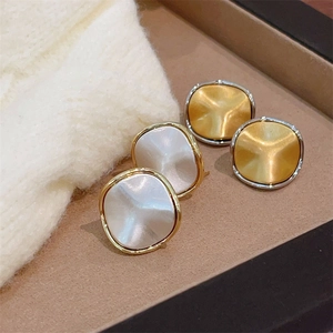 Minimalist brushed metal square stud earrings set in gold and silver finishes