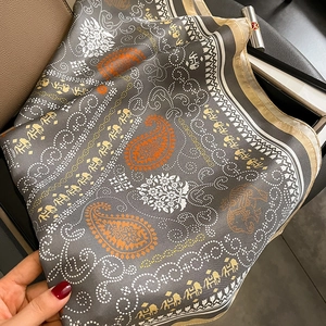 Deep grey silk twill square scarf with orange paisley patterns and golden elephant borders