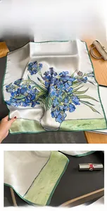 Detail of silk scarf showing vintage iris floral print and rolled hem stitching