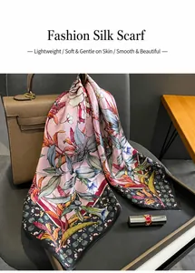 Silk floral scarf elegantly draped on a leather handbag with a stylish lifestyle background