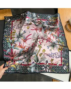 Detailed macro view of the premium floral silk scarf with precise stitched edges