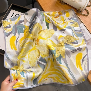 Floral silk scarf with yellow and grey hand-painted patterns on smooth fabric