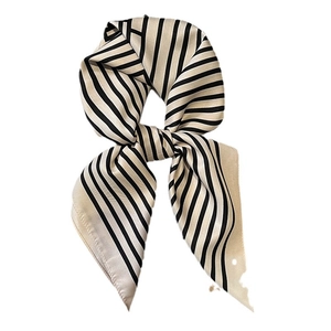 Classic black and white striped satin silk neck scarf for women in a stylish knotted display