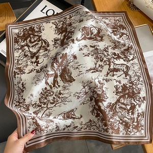 Detail of silk square scarf featuring dark brown Toile de Jouy jungle animal print