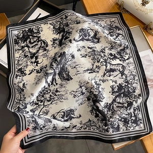 Detail of silk square scarf with vintage Toile de Jouy jungle animal print and striped edge