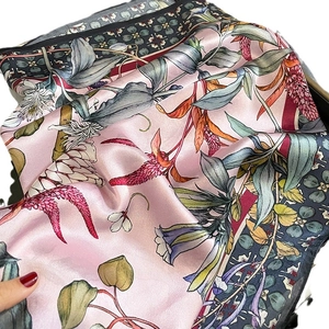 Elegant pink silk floral scarf with botanical print and decorative geometric borders