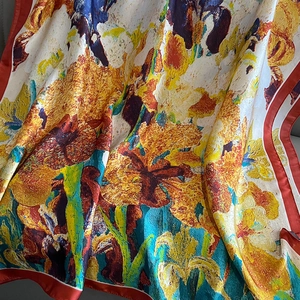 Detailed view of artistic oil painting style silk scarf with vibrant iris flower patterns