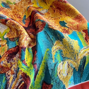 Macro shot of colorful oil painting floral silk scarf with textured crepe fabric details