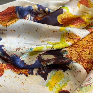 Macro detail of artistic oil painting print on silky smooth fabric scarf texture