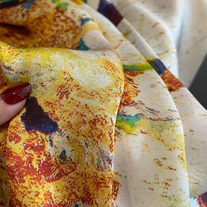 Close-up of abstract oil painting print on smooth silk scarf with soft fabric drapes