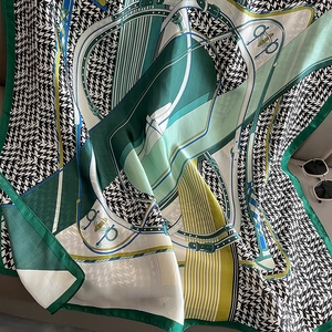 Green houndstooth silk scarf with classic equestrian patterns and horse-bit print