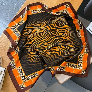 Fashionable zebra and leopard print silk square scarf with orange borders and chain detail