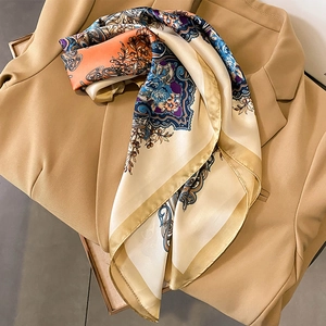 Elegant silk scarf with baroque paisley print styled on a khaki blazer for women